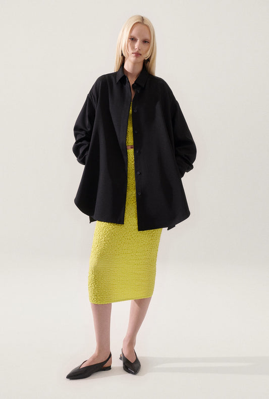 Image of a model wearing Outerwear. Productname: Wool Overshirt Black in Black colour by brand - Silk Laundry