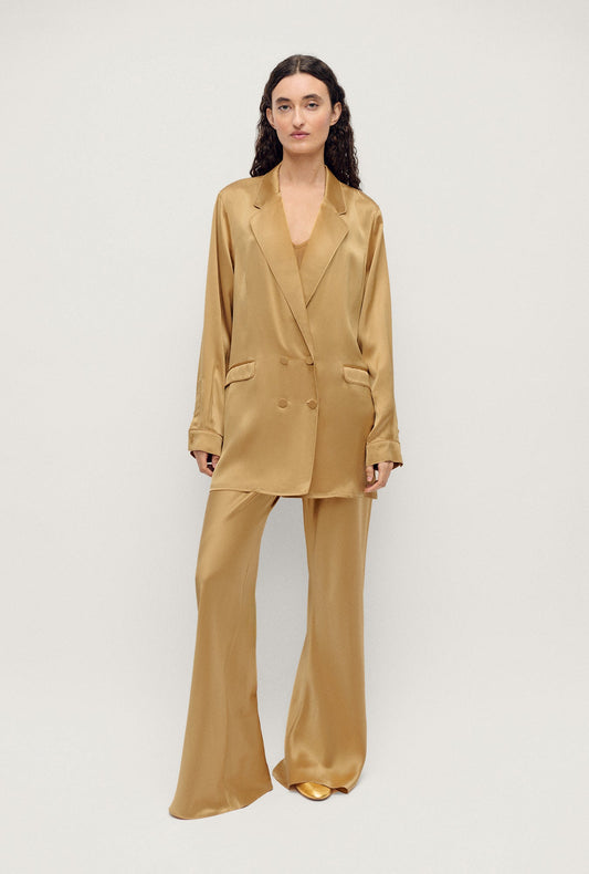 Image of a model wearing Outerwear. Product name - Relaxed Blazer Cowrie in Cowrie colour by brand - Silk Laundry
