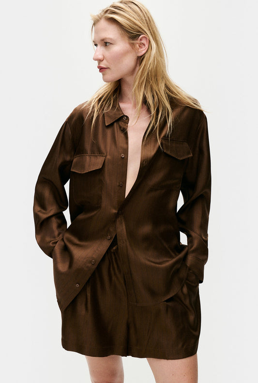 Image of a model wearing Tops. Productname: Silk Laundry Twill Boyfriend Shirt in Dark Earth Pinstripe colour by brand - Silk Laundry