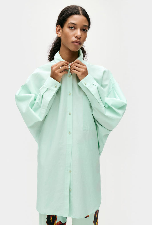 Image of a model wearing Tops. Productname: Silk Laundry COTTON SILK ROUND SHIRT in Dew colour by brand - Silk Laundry