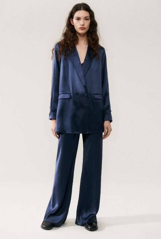 Image of a model wearing Outerwear. Product name - Relaxed Blazer Midnight in Midnight colour by brand - Silk Laundry