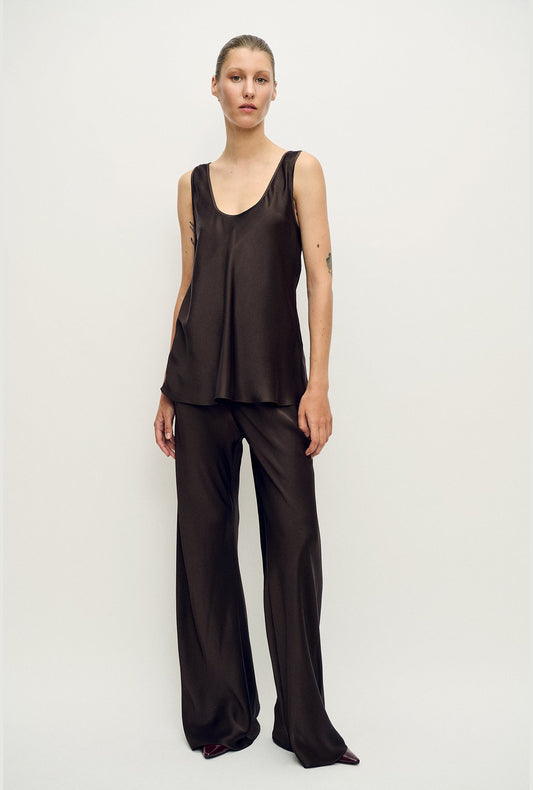 Image of a model wearing Pants. Product name - Bias Cut Pants Mantis in Mantis colour by brand - Silk Laundry