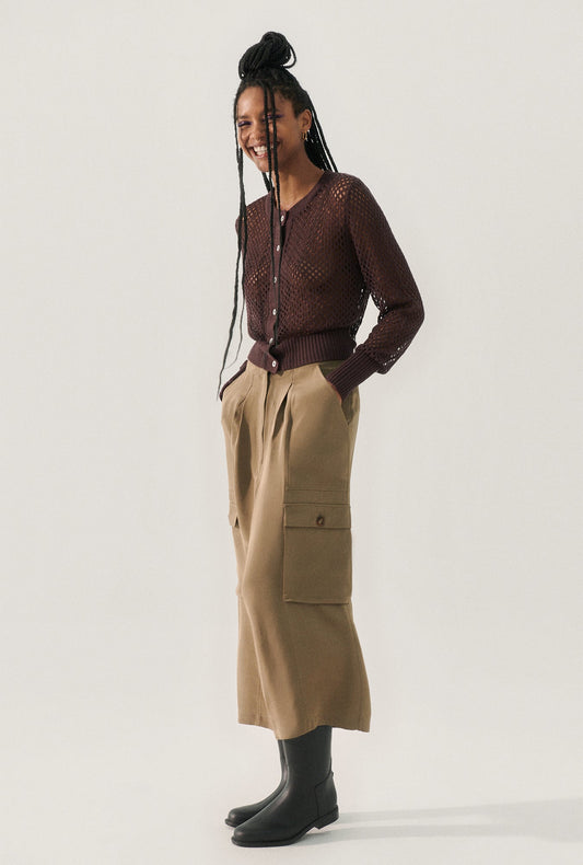 Image of a model wearing Outerwear. Productname: Crochet Cropped Cardigan Cacao in Cacao colour by brand - Silk Laundry