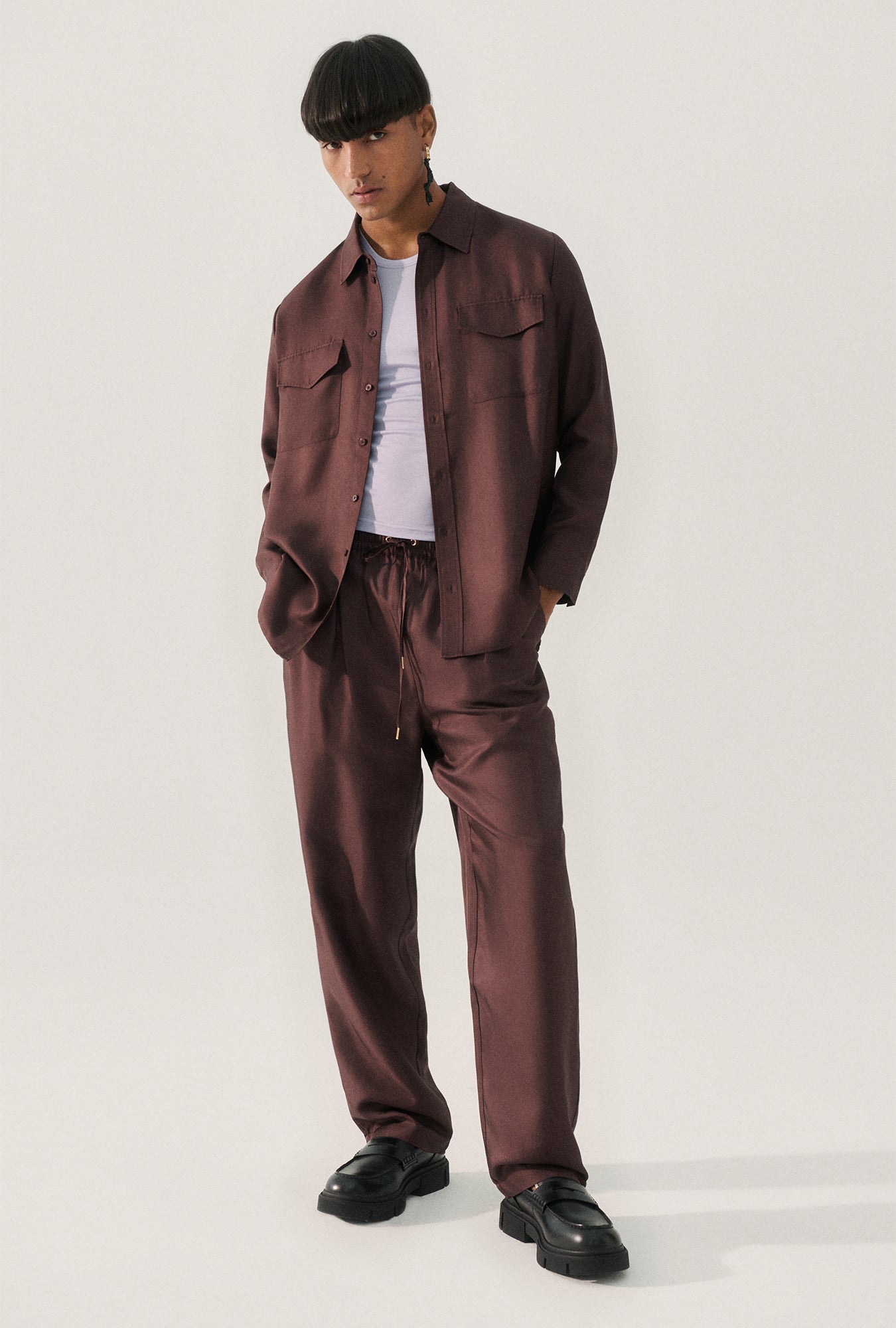 Image of a model wearing Pants. Product name - Twill Slouch Pants Cacao in Cacao colour by brand - Silk Laundry