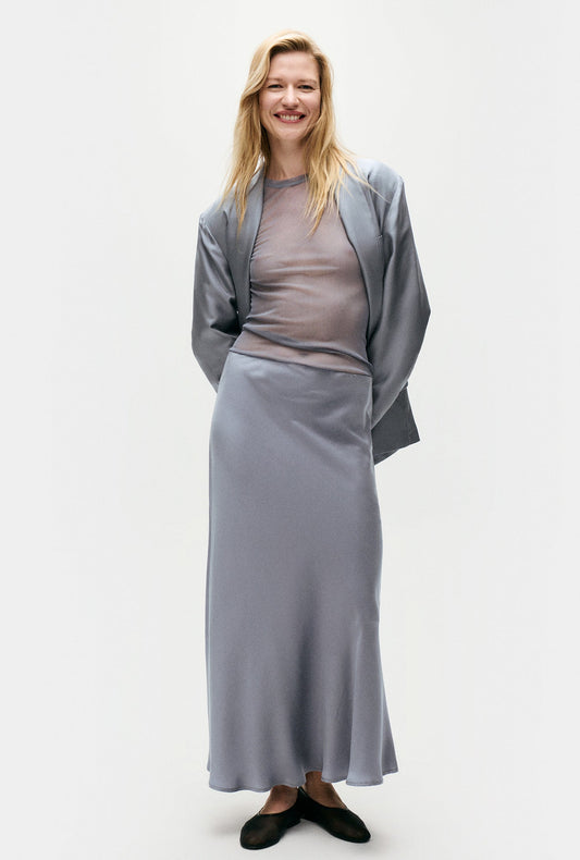 Image of a model wearing Skirts. Productname: Silk Laundry Long Bias Cut Skirt in Storm colour by brand - Silk Laundry