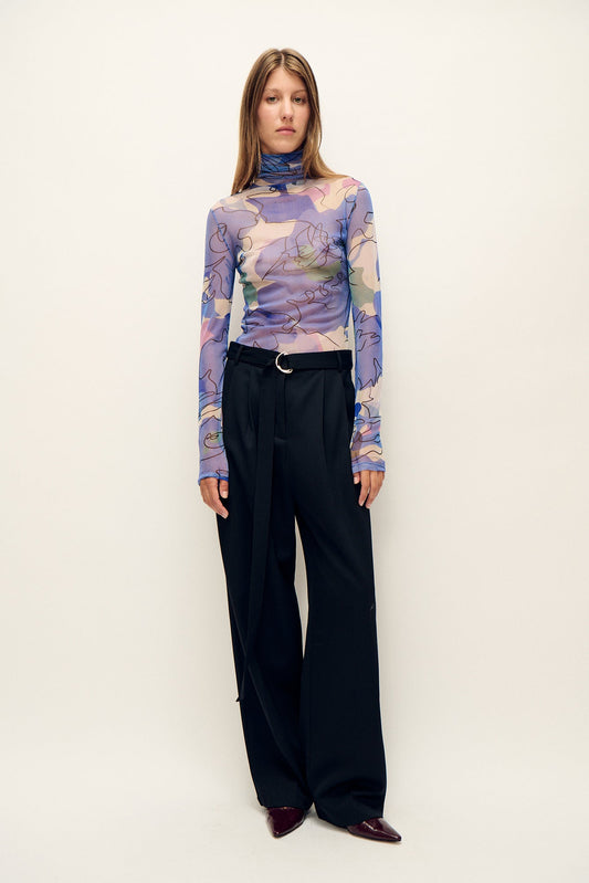 Image of a model wearing Tops. Product name - Mesh Turtleneck Cornflower Floral in Cornflower Floral colour by brand - Silk Laundry