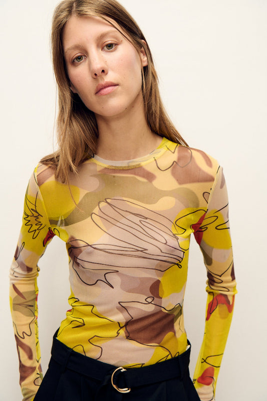 Image of a model wearing Tops. Productname: Mesh Long Sleeve Top Sunflower Floral in Sunflower Floral colour by brand - Silk Laundry