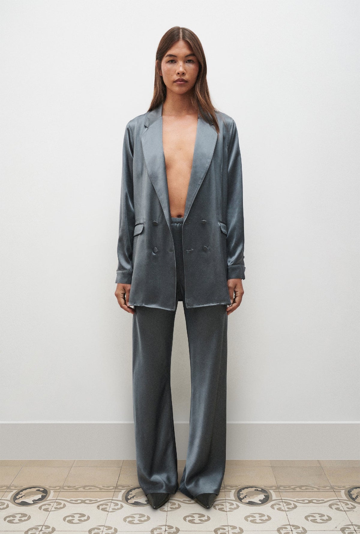 Image of a model wearing Pants. Product name - Bias Cut Pants Slate in Slate colour by brand - Silk Laundry