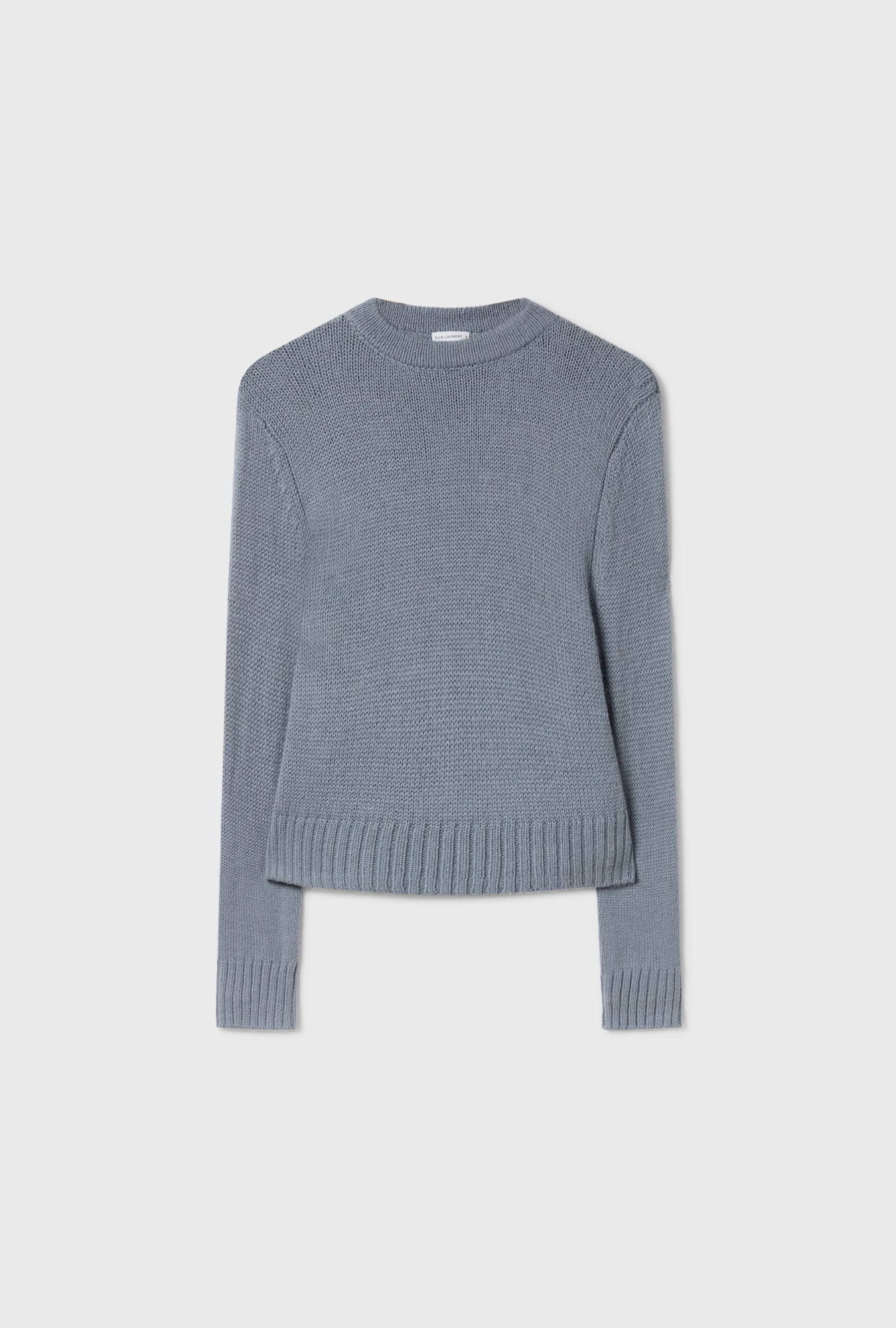 Image of a model wearing Outerwear. Product name - Alpaca Cropped Crewneck Storm in Storm colour by brand - Silk Laundry