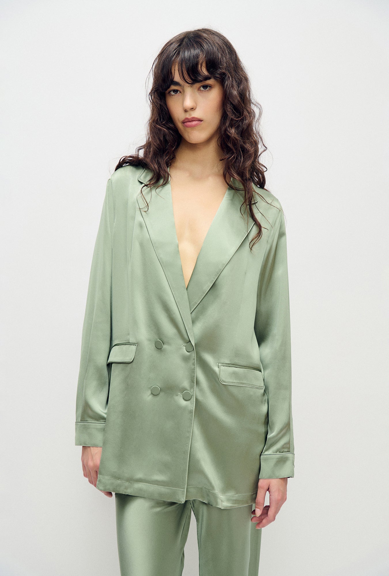 Image of a model wearing Outerwear. Product name - Relaxed Blazer Moonshine in Moonshine colour by brand - Silk Laundry