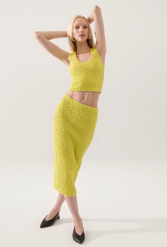 Image of a model wearing Tops. Productname: Popcorn Cropped Cami Absinthe in Absinthe colour by brand - Silk Laundry