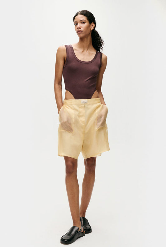 Image of a model wearing Tops. Productname: Silk Laundry Jersey Modal Cutaway Bodysuit in Cacao colour by brand - Silk Laundry