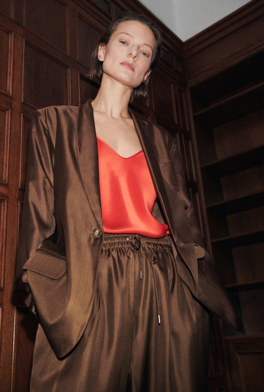 Image of a model wearing Outerwear. Productname: Silk Laundry Twill Miami Blazer in Dark Earth Pinstripe colour by brand - Silk Laundry