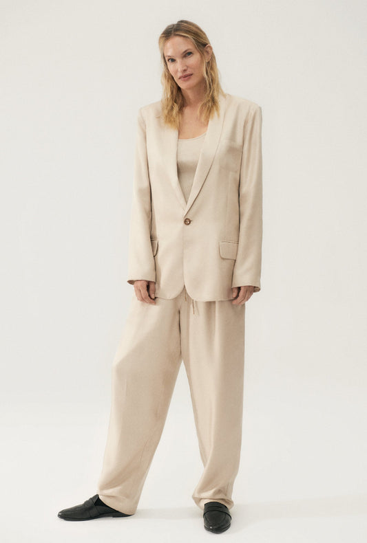 Image of a model wearing Outerwear. Product name - Twill Miami Blazer Hazelnut in Hazelnut colour by brand - Silk Laundry