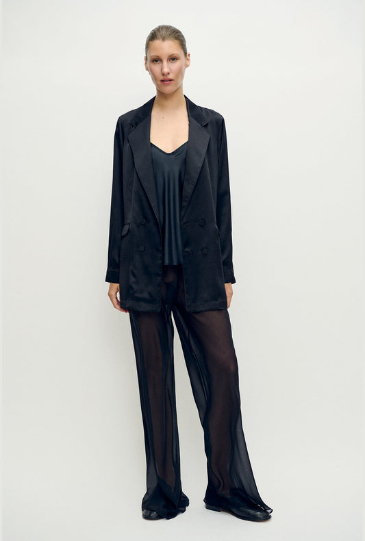Image of a model wearing Outerwear. Product name - Relaxed Blazer Black in Black colour by brand - Silk Laundry