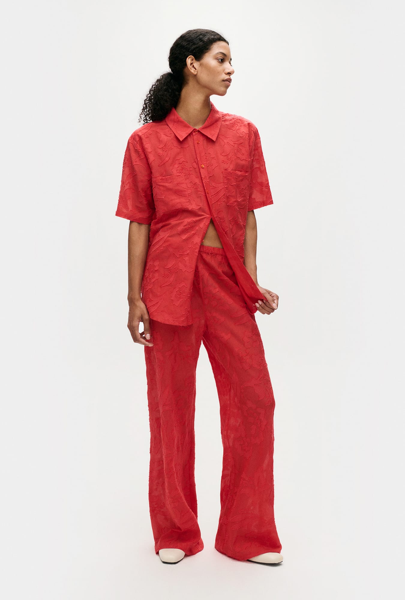Image of a model wearing Pants. Productname: Clip Silk Bias Cut Pants Geranium in Geranium colour by brand - Silk Laundry