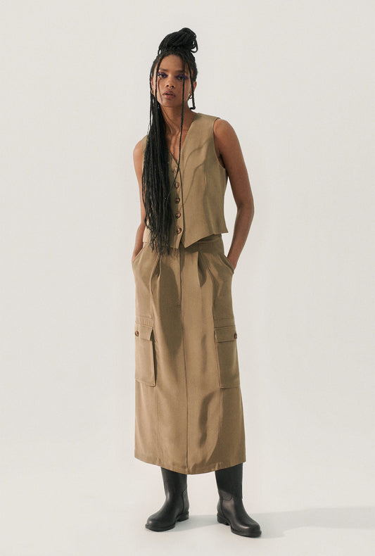 Image of a model wearing Skirts. Product name - CDC Long Suit Skirt Cub in Cub colour by brand - Silk Laundry