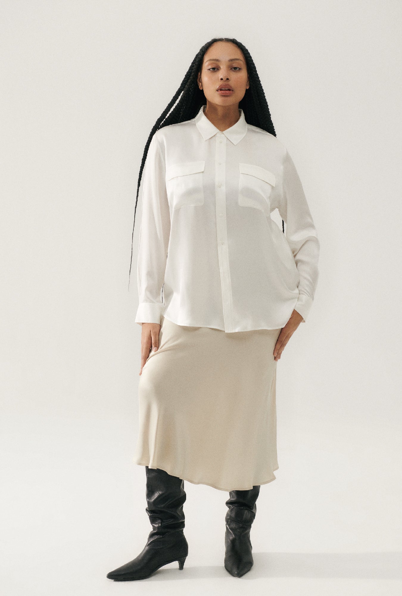 Image of a model wearing Skirts. Product name - Long Bias Cut Skirt Hazelnut in Hazelnut colour by brand - Silk Laundry