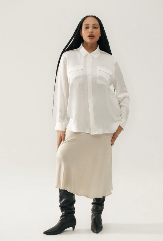 Image of a model wearing Skirts. Product name - Long Bias Cut Skirt Hazelnut in Hazelnut colour by brand - Silk Laundry