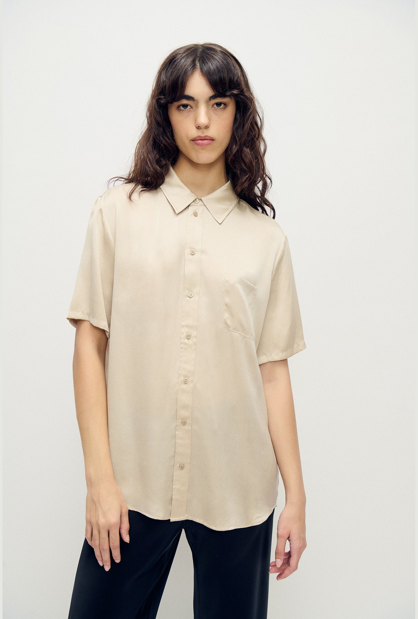 Image of a model wearing Tops. Product name - Short Sleeve Boyfriend Shirt Hazelnut in Hazelnut colour by brand - Silk Laundry