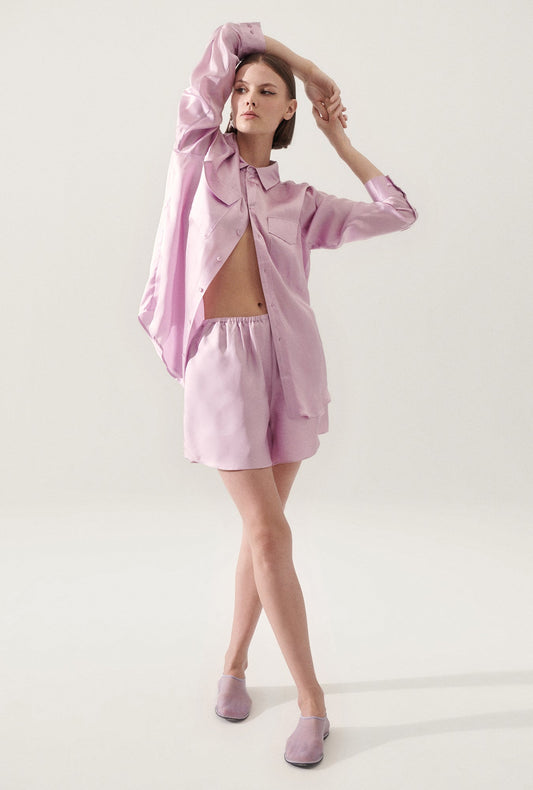 Image of a model wearing Shorts. Product name - Twill Racer Shorts Lilac in Lilac colour by brand - Silk Laundry
