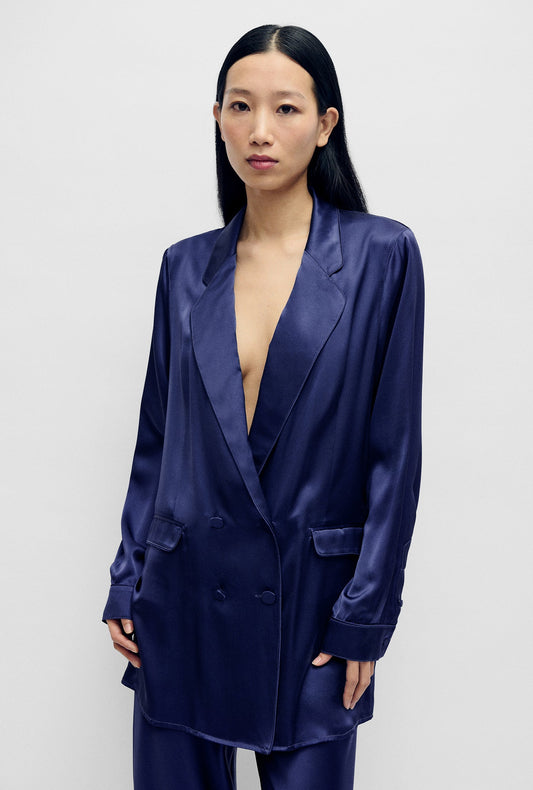 Image of a model wearing Outerwear. Product name - Relaxed Blazer Purple Rain in Purple Rain colour by brand - Silk Laundry