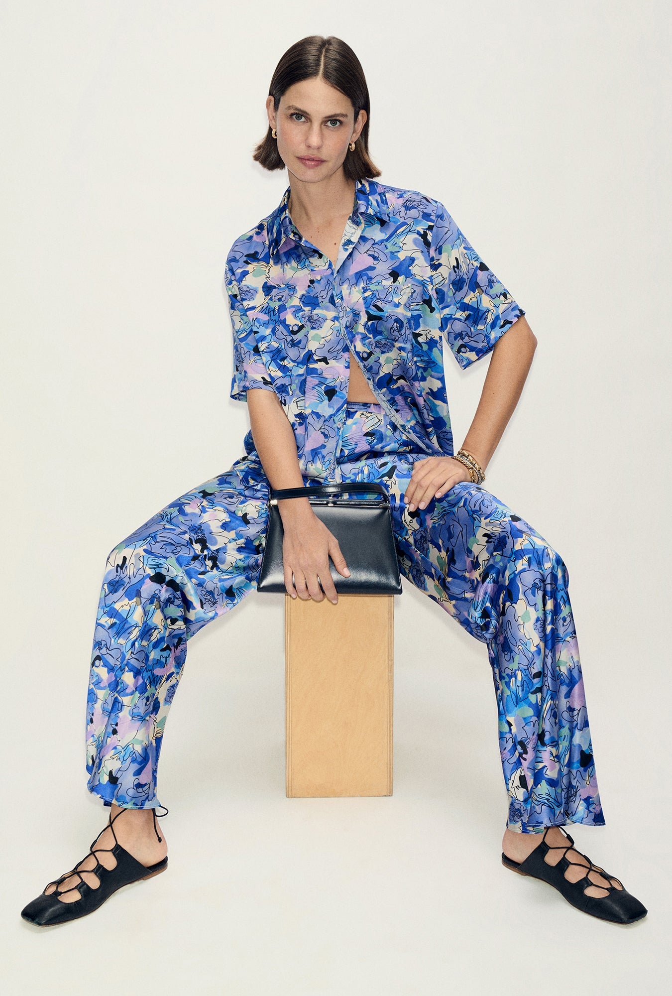 Image of a model wearing Tops. Product name - Short Sleeve Boyfriend Shirt Cornflower Floral in Cornflower Floral colour by brand - Silk Laundry