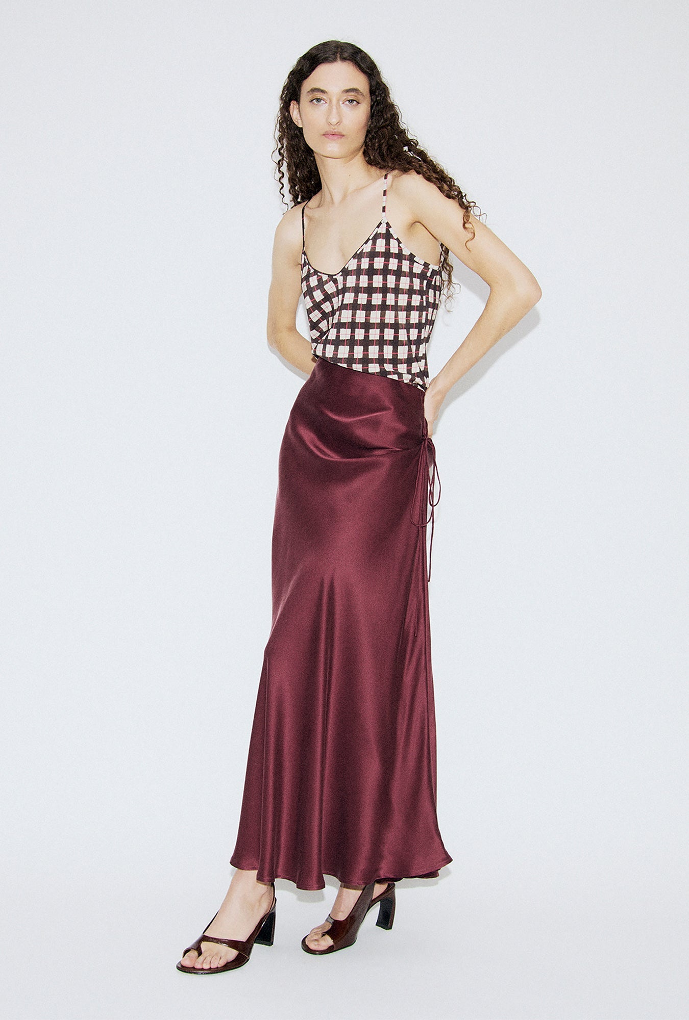 Image of a model wearing Skirts. Product name - Long Bias Cut Skirt Deadleaf in Deadleaf colour by brand - Silk Laundry