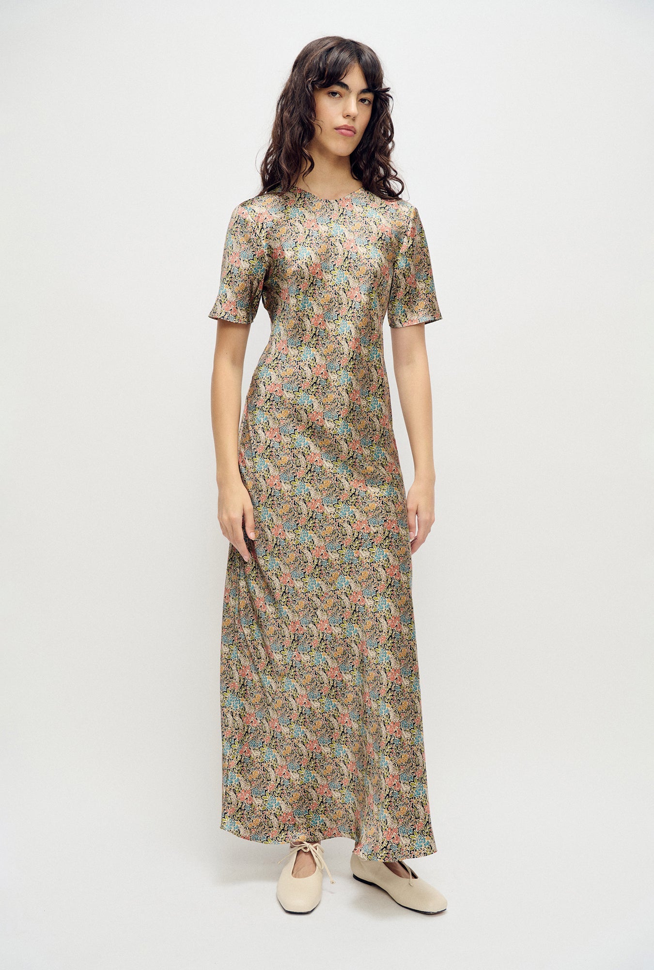 Image of a model wearing Tops. Product name - Short Sleeve Bias Cut Dress Sugar Floral in Sugar Floral colour by brand - Silk Laundry