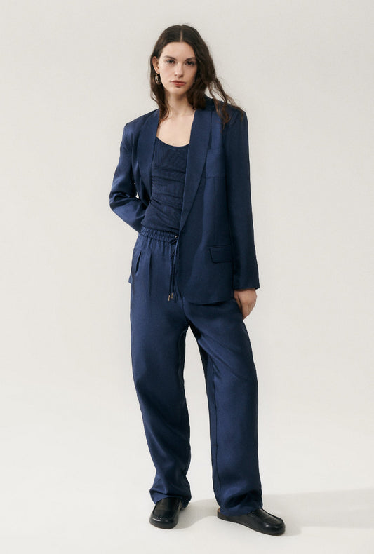 Image of a model wearing Outerwear. Product name - Twill Miami Blazer Midnight in Midnight colour by brand - Silk Laundry