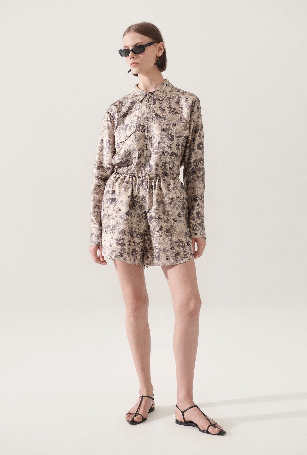 Image of a model wearing Shorts. Product name - Twill Racer Shorts Aster Floral in Aster Floral colour by brand - Silk Laundry