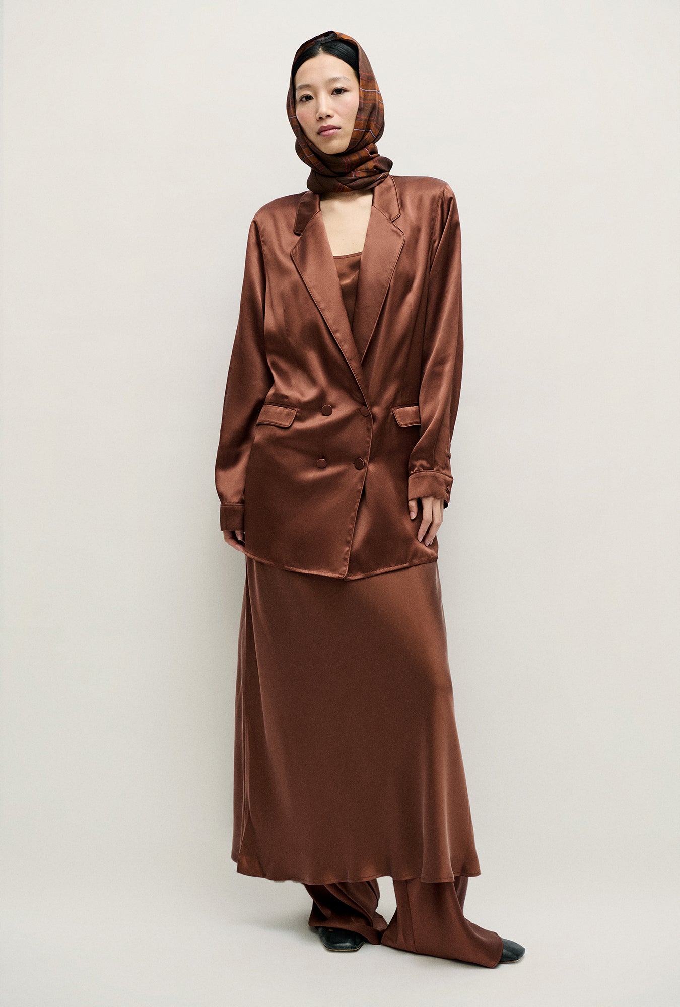 Image of a model wearing Outerwear. Product name - Relaxed Blazer Root in Root colour by brand - Silk Laundry