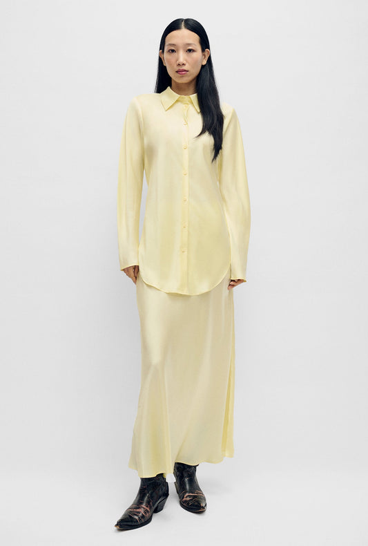 Image of a model wearing Skirts. Product name - Long Bias Cut Skirt Vanilla Flower in Vanilla Flower colour by brand - Silk Laundry