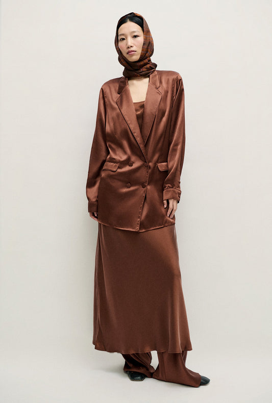 Image of a model wearing Outerwear. Product name - Relaxed Blazer Root in Root colour by brand - Silk Laundry