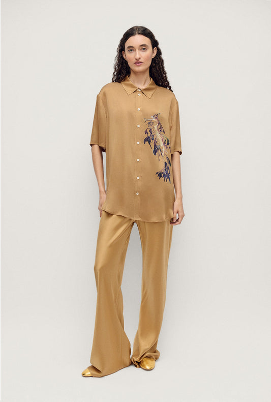 Image of a model wearing Shorts. Productname: Silk Laundry Short Sleeve Boyfriend Shirt in Seahorse colour by brand - Silk Laundry