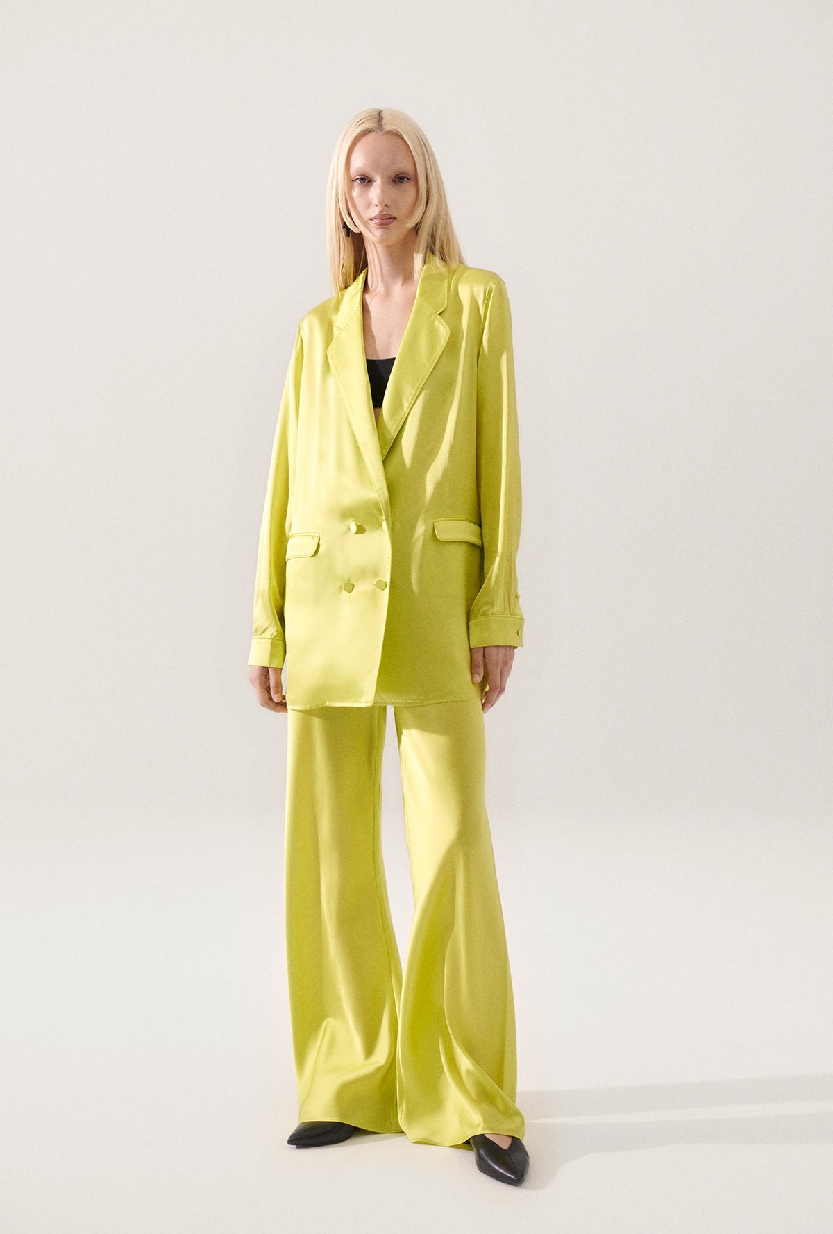 Image of a model wearing Outerwear. Product name - Relaxed Blazer Absinthe in Absinthe colour by brand - Silk Laundry