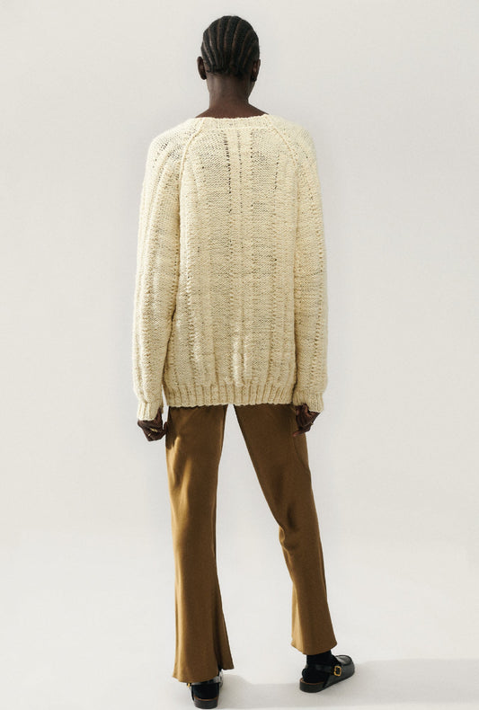 Image of a model wearing Outerwear. Productname: The Big G Cardigan Cream in Cream colour by brand - Silk Laundry