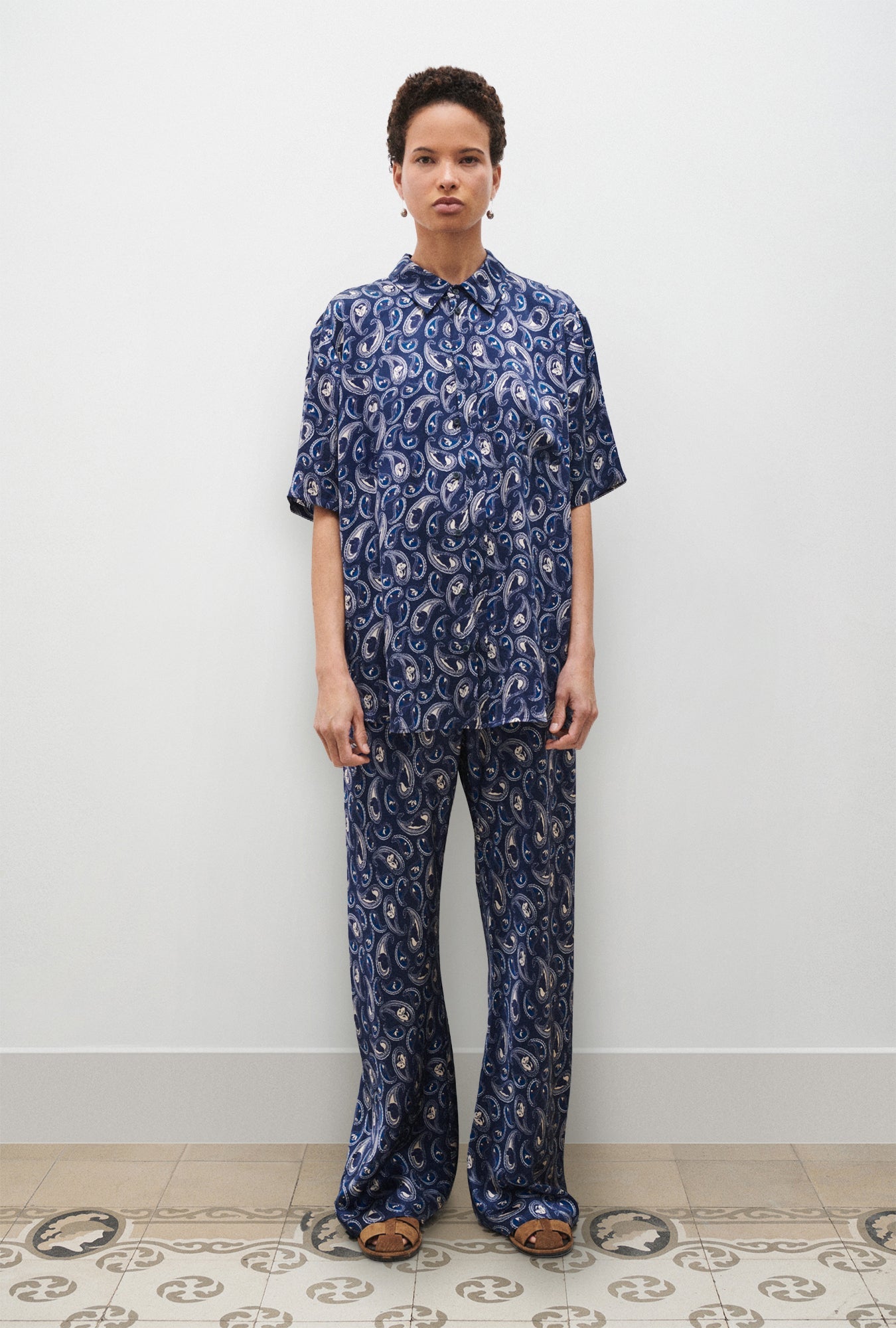 Image of a model wearing Tops. Product name - Short Sleeve Boyfriend Shirt Hounds Paisley in Hounds Paisley colour by brand - Silk Laundry