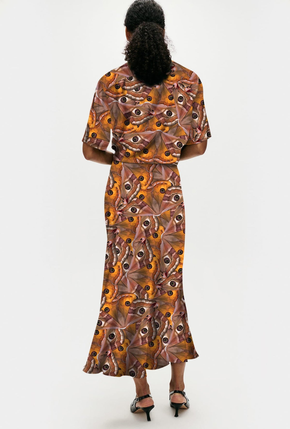 Image of a model wearing Skirts. Product name - Long Bias Cut Skirt Wingspan in Wingspan colour by brand - Silk Laundry