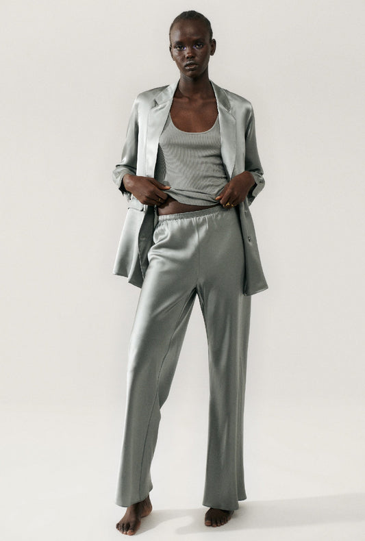 Image of a model wearing Pants. Product name - Bias Cut Pants Moon in Moon colour by brand - Silk Laundry