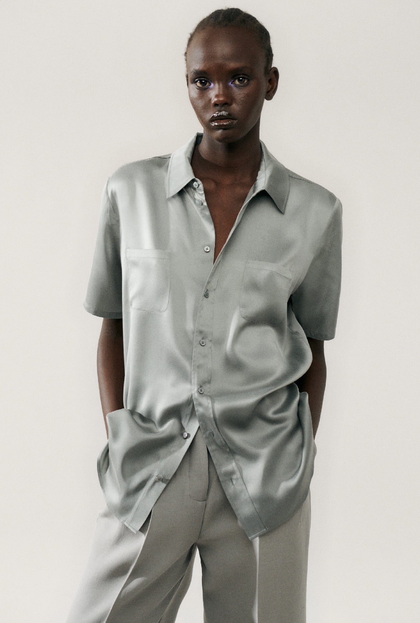 Image of a model wearing Tops. Product name - Short Sleeve Boyfriend Shirt Moon in Moon colour by brand - Silk Laundry