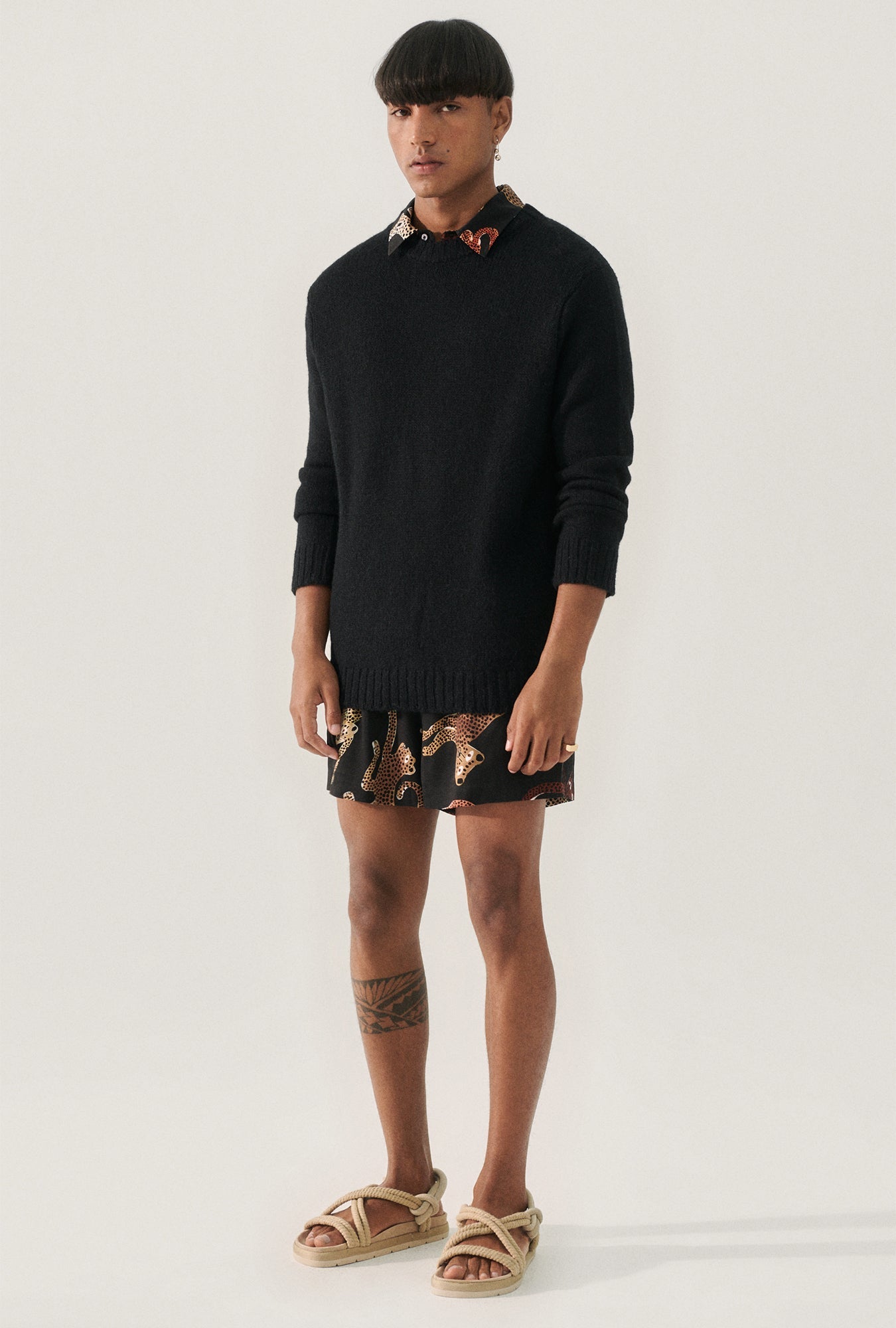 Image of a model wearing Tops. Product name - Knit Crewneck Black in Black colour by brand - Silk Laundry