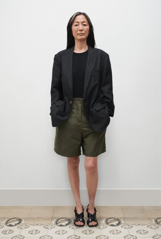 Image of a model wearing Outerwear. Product name - Twill Miami Blazer Black in Black colour by brand - Silk Laundry