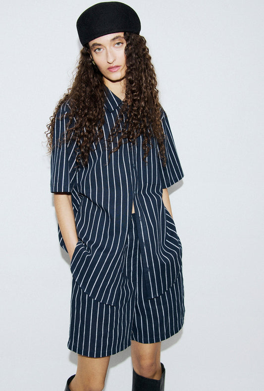 Image of a model wearing Tops. Productname: Cotton Short Sleeve Boyfriend Shirt Egret Stripe in Egret Stripe colour by brand - Silk Laundry