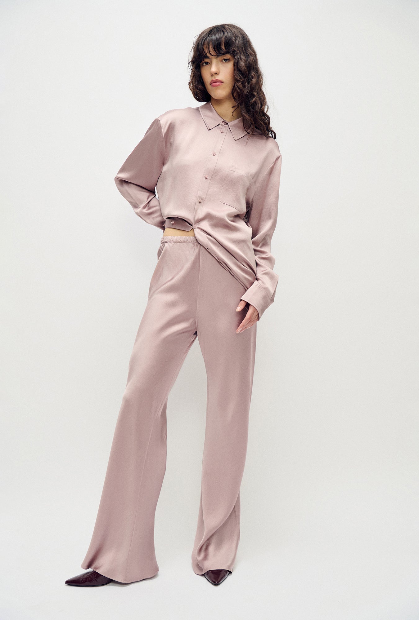 Image of a model wearing Pants. Product name - Hammered Bias Cut Pants Lasso in Lasso colour by brand - Silk Laundry