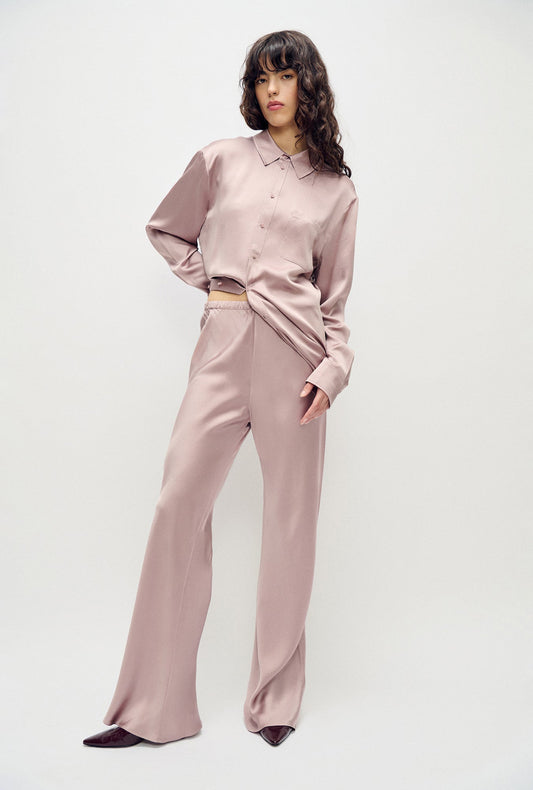 Image of a model wearing Pants. Product name - Hammered Bias Cut Pants Lasso in Lasso colour by brand - Silk Laundry
