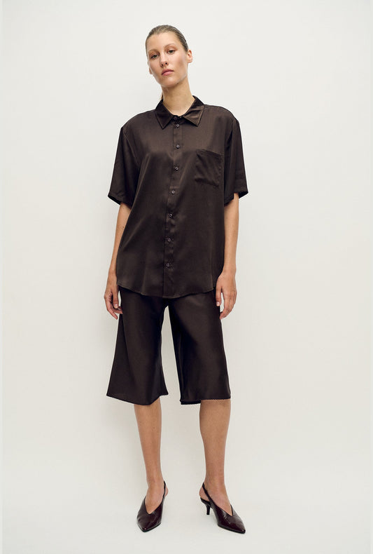 Image of a model wearing Tops. Product name - Short Sleeve Boyfriend Shirt Mantis in Mantis colour by brand - Silk Laundry