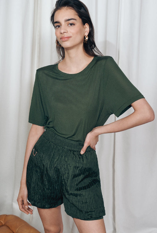 Image of a model wearing Shorts. Product name - Crinkle Shorts Cedar in Cedar colour by brand - Silk Laundry