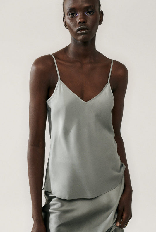 Image of a model wearing Tops. Productname: Bias Cut Cami Moon in Moon colour by brand - Silk Laundry