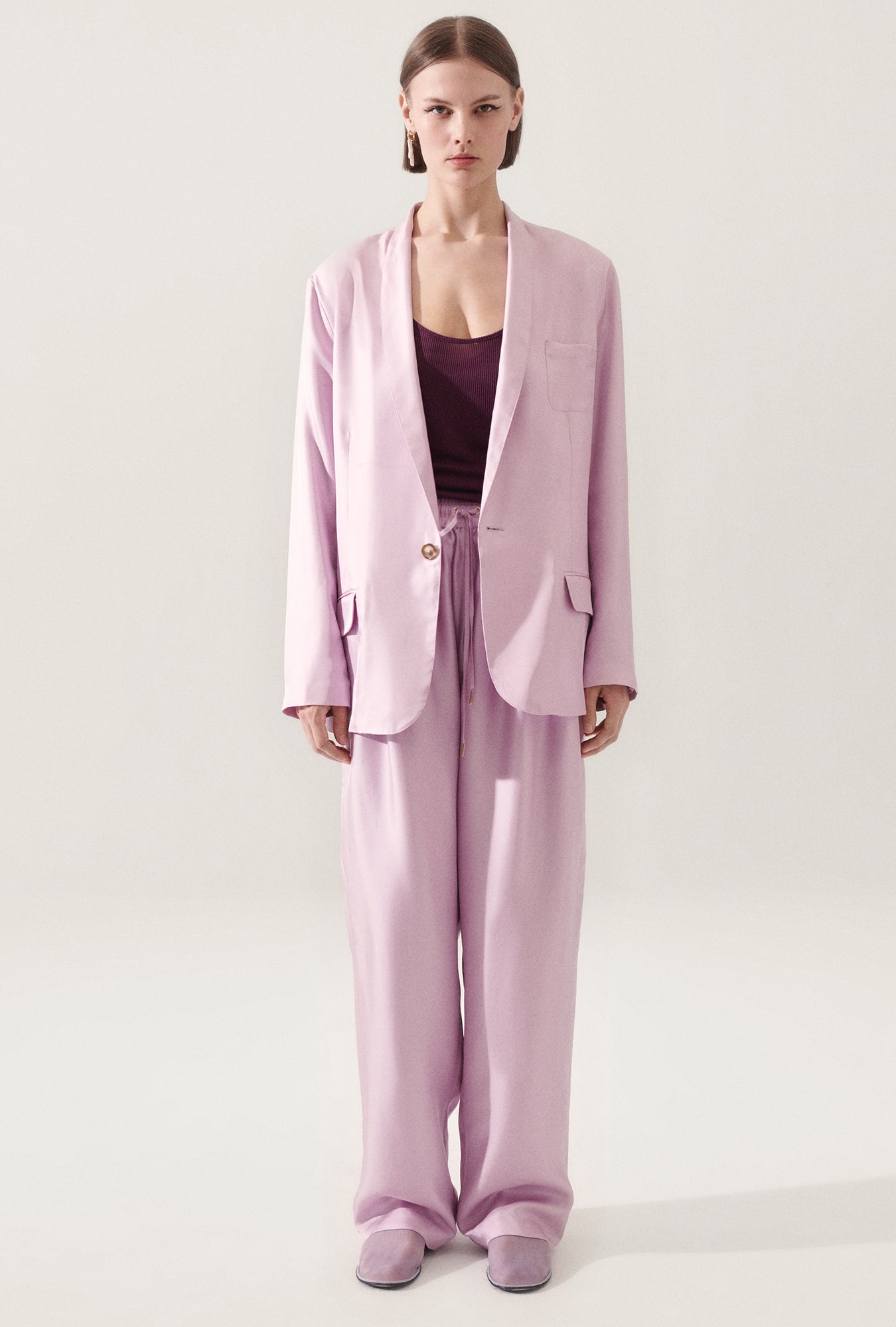 Image of a model wearing Outerwear. Product name - Twill Miami Blazer Lilac in Lilac colour by brand - Silk Laundry